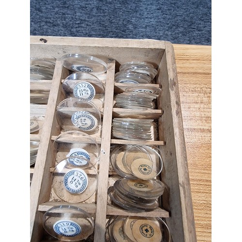 287 - Watchmakers job lot of wristwatch glass crystals in an organised tray containing hundreds of various... 