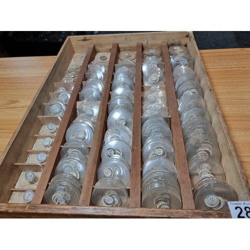 289 - Watchmakers job lot of pocket watch glass crystals in an organised tray containing hundreds of vario... 