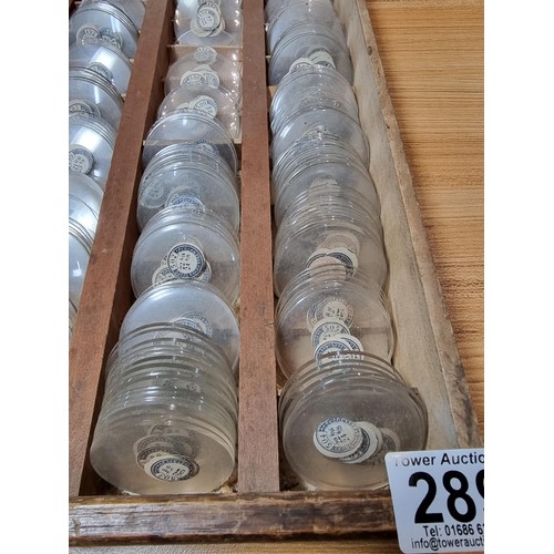 289 - Watchmakers job lot of pocket watch glass crystals in an organised tray containing hundreds of vario... 