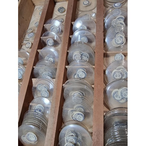 289 - Watchmakers job lot of pocket watch glass crystals in an organised tray containing hundreds of vario... 