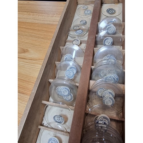 289 - Watchmakers job lot of pocket watch glass crystals in an organised tray containing hundreds of vario... 