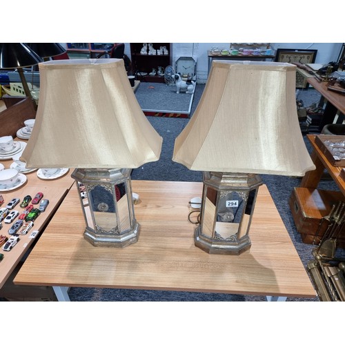 294 - Pair of large impressive table lamps with ornate gilded mirrored lamp bases. The lamp bases are mirr... 