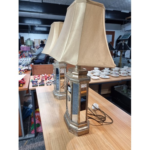 294 - Pair of large impressive table lamps with ornate gilded mirrored lamp bases. The lamp bases are mirr... 