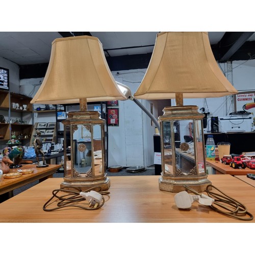 294 - Pair of large impressive table lamps with ornate gilded mirrored lamp bases. The lamp bases are mirr... 