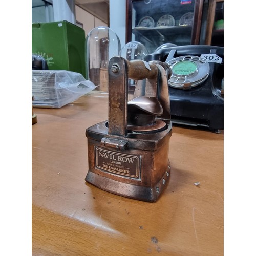 304 - Impressive large solid copper flat iron formed table lighter by Savil Row, in good working condition... 