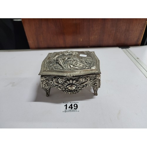 149 - Ornate metal red velvet lined trinket box with ornate design lovers scene to the top, floral designs... 