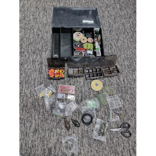 62A - A TF Gear fishing tackle box containing a quantity of various well organized tackle including weight... 