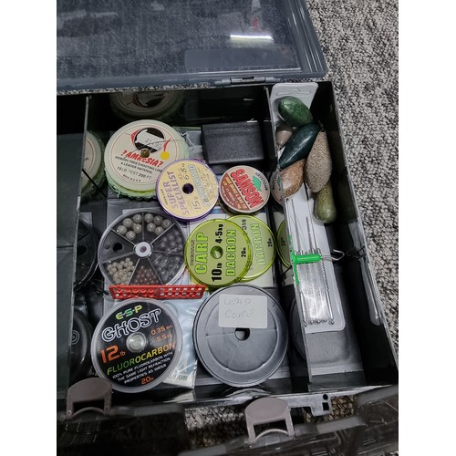 62A - A TF Gear fishing tackle box containing a quantity of various well organized tackle including weight... 