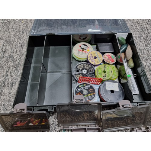 62A - A TF Gear fishing tackle box containing a quantity of various well organized tackle including weight... 