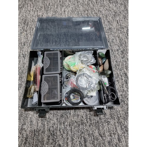 62A - A TF Gear fishing tackle box containing a quantity of various well organized tackle including weight... 