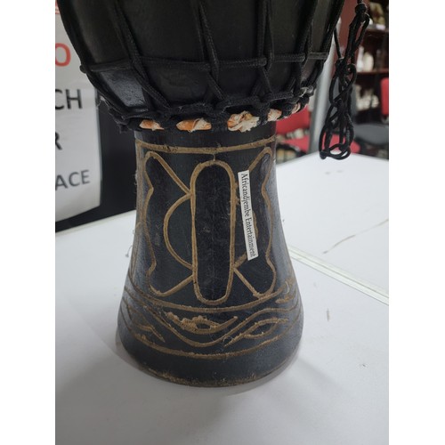 427A - A good quality djembe drum in excellent clean condition having a taut skin standing 46cm high, top d... 