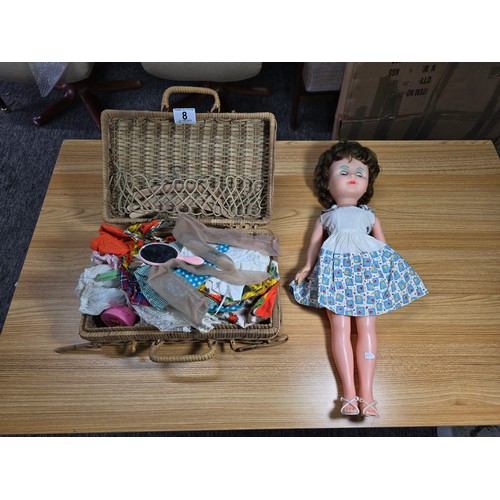 8 - A vintage doll complete with a good wicker basket containing a large quantity of good quality vintag... 