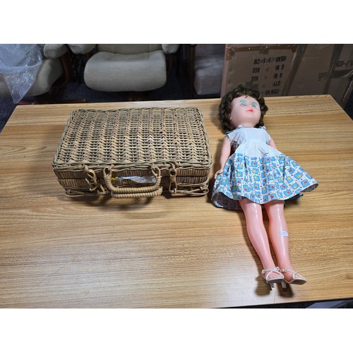 8 - A vintage doll complete with a good wicker basket containing a large quantity of good quality vintag... 