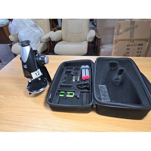 12 - An Edu science microscope complete with its protective case and a small quantity of accessories with... 