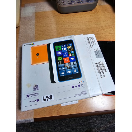 22 - A Microsoft Lumia 640 mobile phone complete with its original box, in vibrant orange, has been reset... 