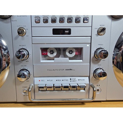 32 - A large impressive re-production portable battery powered boombox by GPO, complete with radio, tape,... 