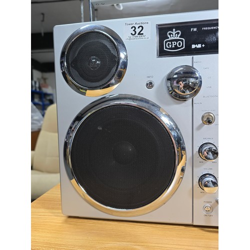32 - A large impressive re-production portable battery powered boombox by GPO, complete with radio, tape,... 