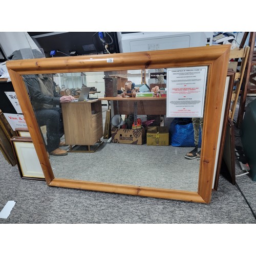 75 - Very large good quality pine framed bevel edged mirror measures 110cm high, 139cm long, has screw fi... 