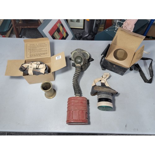 77 - Collection of WWII gas masks inc 2x in original boxes one has a carry case both are marked Poppe lot... 