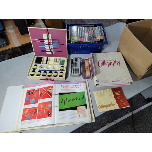 85 - Quantity of calligraphy items inc 2x Calligraphy binders, and a box containing Calligraphy pens ink ... 