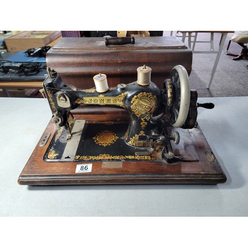 86 - Cased antique Jones sewing machine with a supplied by Bunners, Montgomery plaque, No. 249728 with or... 