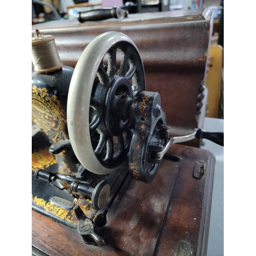 86 - Cased antique Jones sewing machine with a supplied by Bunners, Montgomery plaque, No. 249728 with or... 