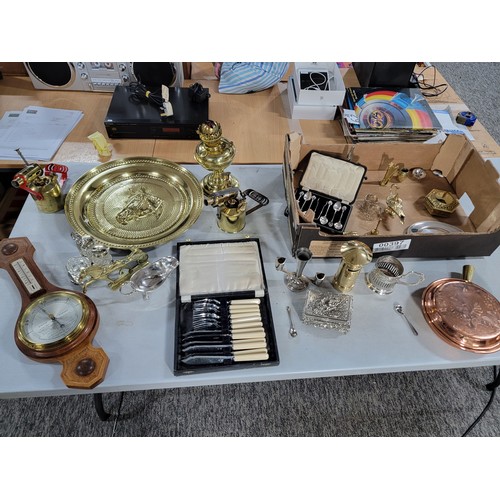 103 - A box of collectables including brass ware, plated ware, James Deacon plated cruet set, a brass oil ... 