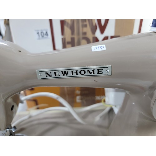 104 - New Home vintage sewing machine complete with pedal model number 131 comes with a small quantity of ... 