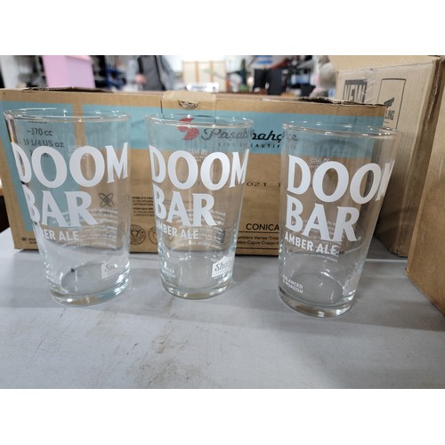 105 - 3x boxes of pint glasses 67 in total inc Cors Light and Doom Bar