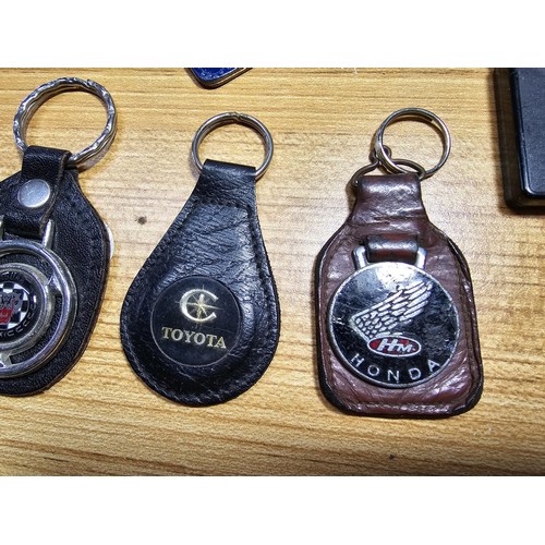 37 - A large quantity of various vintage collectable car related keyrings to include some early vintage c... 