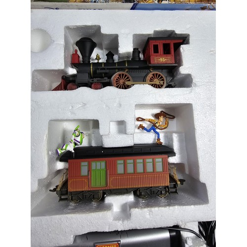 40 - A rare Hornby R1149 Toy Story 3 train set, all boxed with track mat and all paperwork, with controll... 