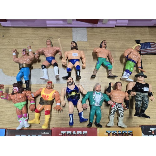 60 - A collection of 11x WWF (Now WWE) wrestling figures all from 1990 and 1991 along with 6x ladybird th... 