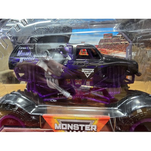 65 - A quantity of toys to include a boxed as new Monster Jam Mohawk Warrior monster truck toy by Spin Ma... 