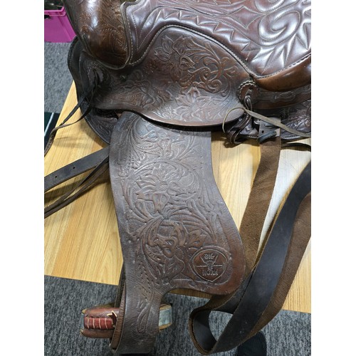 168 - A good quality vintage genuine Big Horn western leather saddle with an ornate embossed decoration al... 