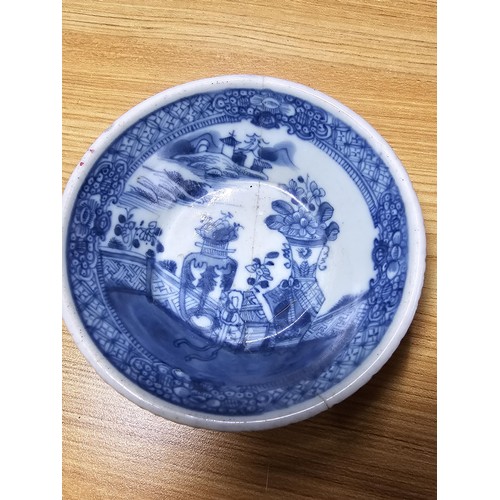 185 - A large antique Chinese bowl with a thick enamel hand painted design featuring a scene of sprays of ... 