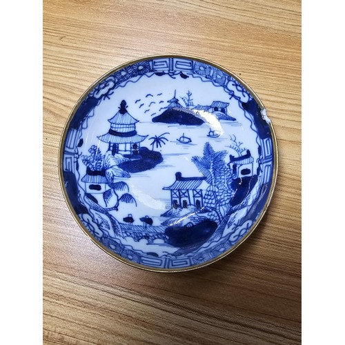 185 - A large antique Chinese bowl with a thick enamel hand painted design featuring a scene of sprays of ... 