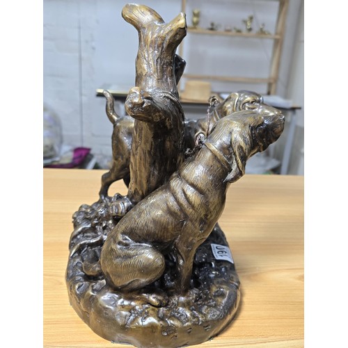 190 - A large and impressive solid bronze sculpture of 2 hunting hounds tied to a tree stump by Grace Mott... 