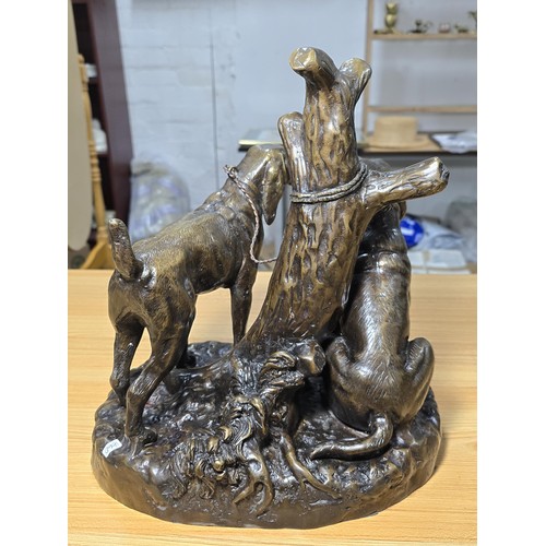 190 - A large and impressive solid bronze sculpture of 2 hunting hounds tied to a tree stump by Grace Mott... 