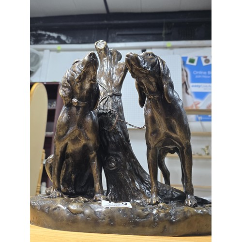 190 - A large and impressive solid bronze sculpture of 2 hunting hounds tied to a tree stump by Grace Mott... 