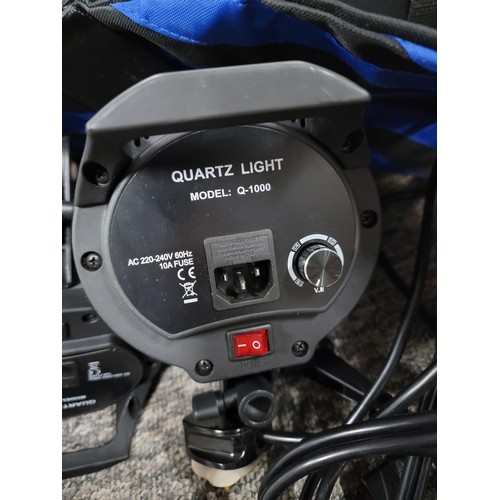 141 - A cased set of  3 professional photoshoot spot lamps marked Quartz light model Q-1000 static photogr... 