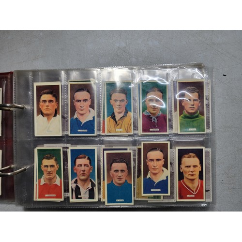 149 - A book of cigarette cards in plastic sleeves - sets, part sets and odds. Mainly sports, most are fro... 