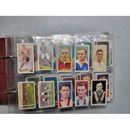 149 - A book of cigarette cards in plastic sleeves - sets, part sets and odds. Mainly sports, most are fro... 