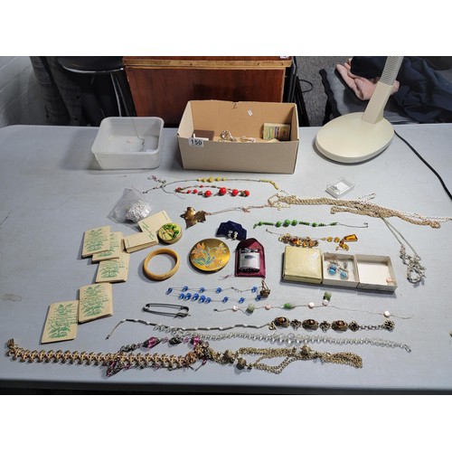 150 - Box containing a large quantity of costume jewellery inc necklaces, bracelets, gold coloured leaf, c... 