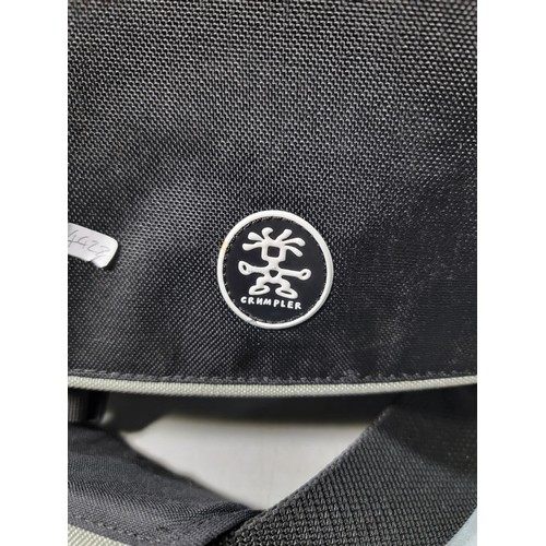 154 - A Crumpler camera bag, well fitted inside with many compartments.