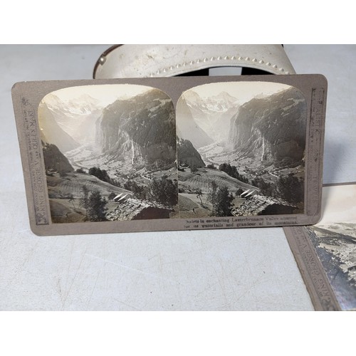 164 - A stereoscope in good clean condition along with 4 of its slides which includes a dramatic slide of ... 