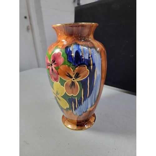 165 - An impressive tall hand painted lustre vase by Old Court Ware with vibrant colours and in good order... 