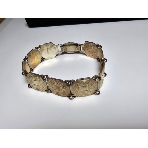 196 - A good early vintage 925 silver panel link bracelet from the 1940's, each panel has an ornate engrav... 