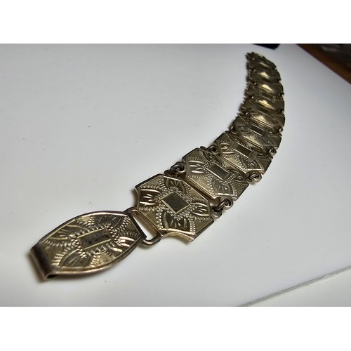 196 - A good early vintage 925 silver panel link bracelet from the 1940's, each panel has an ornate engrav... 