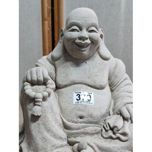 370 - Large concrete buddha figure with good detailing stands at 28cm high, 28cm long, 20cm deep