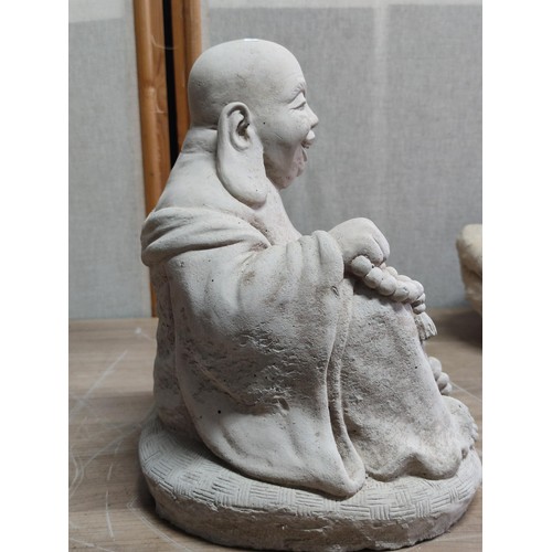 370 - Large concrete buddha figure with good detailing stands at 28cm high, 28cm long, 20cm deep